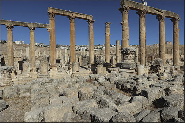 Ruins along paved avenue that runs through archaeological site